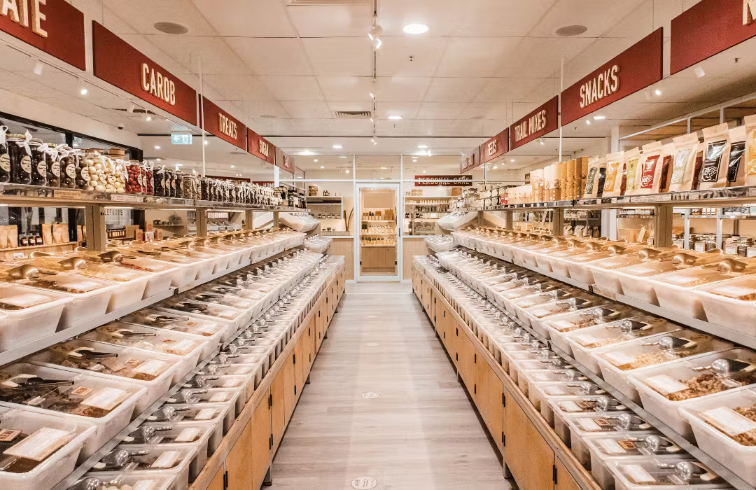 Wholefoods displayed along the shelves of a Scoop store